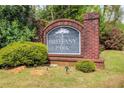 Brittany Park neighborhood sign surrounded by lush greenery on a sunny day at 2580 Brittany Park Cv, Ellenwood, GA 30294