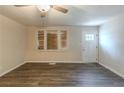 Bright living room featuring hardwood floors, ceiling fan and windows at 388 Belgarde Se Pl, Atlanta, GA 30354