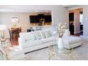 Open-concept living room with a neutral color palette and seamless flow to the kitchen at 1980 Beyers Landing Dr, Buford, GA 30519