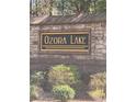 Stone entrance sign for Ozora Lake community at 3478 Spring Place Ct, Loganville, GA 30052