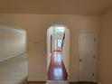 Inviting foyer with hardwood floors and a view of the grand staircase and front door at 3963 Lucas Ln, Ellenwood, GA 30294