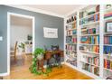 Cozy living room showcasing hardwood floors, built-in bookshelves, and neutral-toned walls at 4162 Brownlee Dr, Tucker, GA 30084