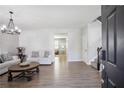 Bright and airy living room featuring modern decor, stylish furniture, and elegant flooring, perfect for relaxing or entertaining at 1218 Lanier Springs Dr, Buford, GA 30518
