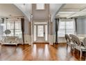Open foyer featuring hardwood floors, elegant decor, and an abundance of natural light at 9 Oatgrass Dr, Grayson, GA 30017