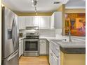 Bright kitchen features modern stainless steel appliances and white subway tile backsplash at 1101 Juniper Ne St # 922, Atlanta, GA 30309