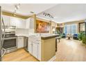 Charming kitchen boasting bright white cabinets, stainless steel appliances, and an open concept layout at 1101 Juniper Ne St # 922, Atlanta, GA 30309