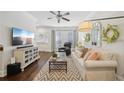 Cozy living room featuring hardwood floors, a ceiling fan, and bright natural light at 1119 Glenridge Pl, Atlanta, GA 30342