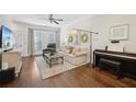 Inviting living room featuring hardwood floors, ceiling fan, and stylish decor at 1119 Glenridge Pl, Atlanta, GA 30342