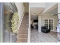 Inviting foyer with hardwood floors, staircase and a view into the cozy living room with fireplace at 1312 Woodland View Rd, Lawrenceville, GA 30043