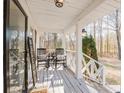 Relaxing front porch with rocking chairs, welcome sign, and decorative hanging lantern at 511 Laird Rd, Hiram, GA 30141