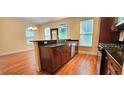 Kitchen with granite counters, stainless appliances and an island which flows into a dining area at 5905 Brookside Oak Cir, Norcross, GA 30093