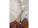 Grand foyer featuring a staircase, hardwood floors, and elegant details, creating a welcoming entrance at 12 Braemore Dr, Atlanta, GA 30328