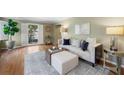 Comfortable living room with hardwood floors, neutral tones, and stylish decor at 2049 Castleway Ne Ln, Atlanta, GA 30345
