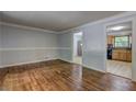 Living room featuring hardwood floors and neutral paint, showing doorway into kitchen at 2270 Cresta Dr, Decatur, GA 30032