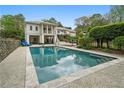 Inviting pool area with spacious patio, lounge chairs, and a beautifully landscaped backyard at 1724 Ridge Valley Nw Ct, Atlanta, GA 30327