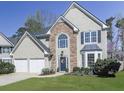 Beautiful two-story home with stone accents, bay windows, manicured landscaping, and a spacious two-car garage at 3822 Harris Nw Blvd, Kennesaw, GA 30144