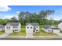 Street view shows many beautiful, two-story homes with green lawns in a residential community at 8595 Secretariat Dr, Lithonia, GA 30058