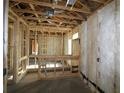 Interior view showcasing the framing and insulation, highlighting the home's construction process at 2055 Ripple Park Bend, Canton, GA 30114