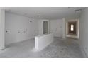 Spacious living room with unfinished flooring and ample natural light at 2055 Ripple Park Bend, Canton, GA 30114