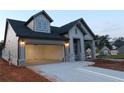 Well-lit single Gathering home with a two-car garage, showing the attractive exterior and neighborhood at 2055 Ripple Park Bnd, Canton, GA 30114
