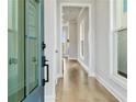 Inviting entry hallway with natural light, hardwood flooring, and neutral paint at 630 Silva St, Cumming, GA 30040