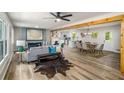 Bright, open concept living space with modern decor, hardwood floors, and a cozy dining area at 3069 Thrasher Cir, Decatur, GA 30032