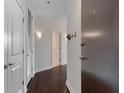 Inviting hallway features sleek dark wood floors and modern lighting fixtures at 855 Peachtree Ne St # 2403, Atlanta, GA 30308