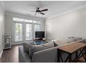 Bright living room with a ceiling fan, and lots of natural light from french doors leading to a balcony at 400 17Th Nw St # 2218, Atlanta, GA 30363
