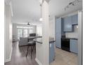 Open-concept living area boasts hardwood floors, modern lighting and a bar overlooking the kitchen at 400 17Th Nw St # 2218, Atlanta, GA 30363