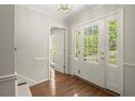 Inviting foyer with hardwood floors and natural light at 6580 Scott Valley Rd, Sandy Springs, GA 30328