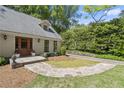 Beautiful home featuring a stone walkway leading to the front door at 6580 Scott Valley Rd, Sandy Springs, GA 30328