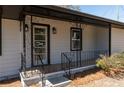 Inviting front porch with decorative iron railings and classic tile flooring detail at 6727 Kull Dr, Lithia Springs, GA 30122