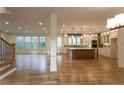 Bright living space features hardwood floors, large windows, and an open-concept kitchen with modern island at 4440 Cannon Rd, Loganville, GA 30052