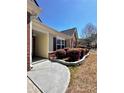 Home exterior showing a well-maintained yard, walkway, and flowerbeds at 779 Harvest Brook Dr, Lawrenceville, GA 30043