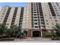 Multi-story condominium building with multiple windows and brick and stucco facade at 1101 Juniper Ne St # 612, Atlanta, GA 30309