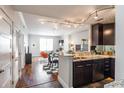 Modern kitchen featuring dark wood cabinets, granite countertops, and stainless steel appliances at 1101 Juniper Ne St # 612, Atlanta, GA 30309