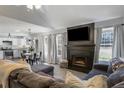 Spacious living area with fireplace, TV, open to kitchen, and comfortable seating at 4419 White Rd, Douglasville, GA 30135