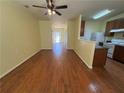 Open-concept living room leading to the kitchen, perfect for entertaining at 257 Brookview Dr, Riverdale, GA 30274