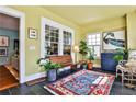 Bright sunroom with large windows, slate floors, and stylish decor at 976 Blue Ridge Ne Ave, Atlanta, GA 30306