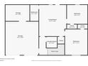 Basement floor plan featuring the laundry room, two bedrooms, the living room, and a two-car garage at 10670 Day Lily Dr, Hampton, GA 30228