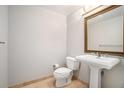 Powder room featuring pedestal sink, framed mirror, and neutral color at 195 14Th Ne St # 1908, Atlanta, GA 30309