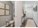 Cozy entryway adjacent to a half bath with sleek decor and hardwood flooring at 2272 Jamin Bnd # 13, Lithonia, GA 30058