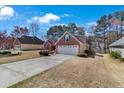 Charming single-story brick home with a well-manicured lawn and attached two car garage at 1050 Sunny Field Ct, Lawrenceville, GA 30043