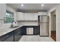 Well-lit kitchen featuring granite countertops, stainless steel appliances and ample cabinet space at 1735 W Austin Rd, Decatur, GA 30032