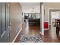 Inviting foyer that opens to a spacious living room with a fireplace and hardwood floors at 5330 Maltdie Ct, Sugar Hill, GA 30518