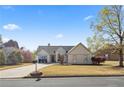 Charming single Gathering home on a sunny day, complete with mature trees and a mailbox at 5330 Maltdie Ct, Sugar Hill, GA 30518