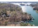 Aerial view showcasing lakefront homes with private boat docks at 7725 Bold Springs Xing, Cumming, GA 30041