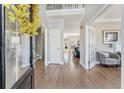 Bright foyer with hardwood floors, high ceilings, and open floor plan at 7725 Bold Springs Xing, Cumming, GA 30041