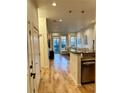 Bright living space with hardwood floors, modern lighting, and view of outdoor area through sliding glass door at 1430 Dresden Dr # 225, Atlanta, GA 30319