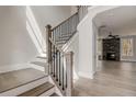 Elegant staircase with wood treads, black iron railing, and tons of natural light at 3298 Rangers Gate, Marietta, GA 30062